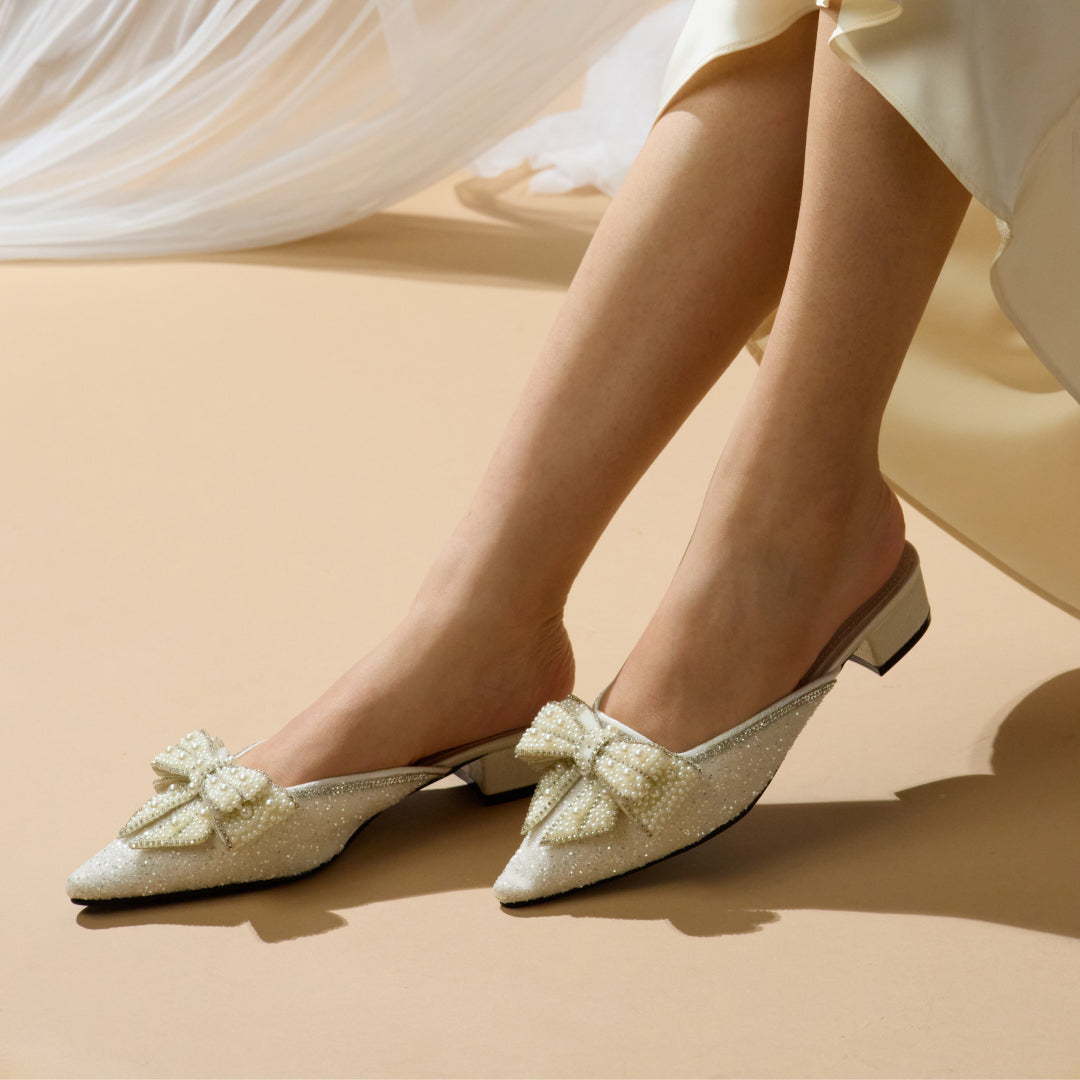 White fashion bow mules